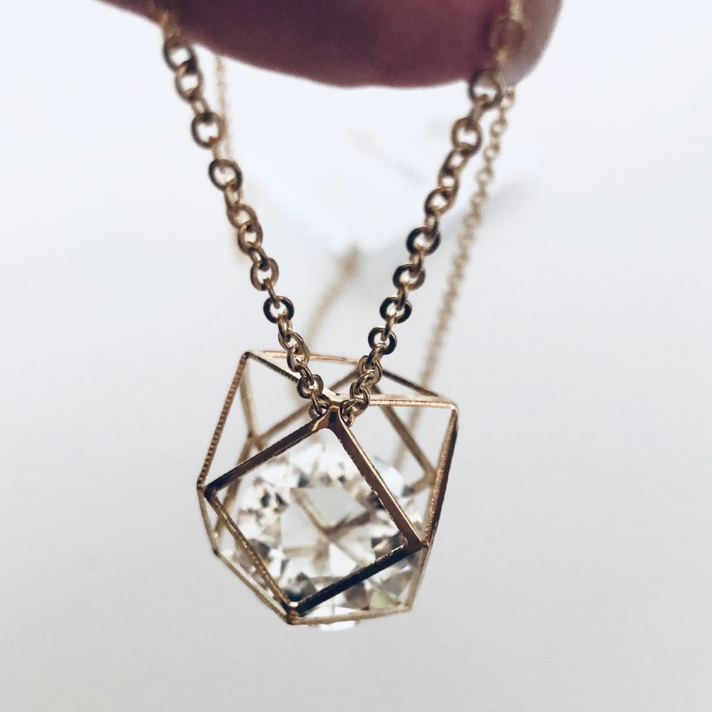 XLong rosegold toned necklace with crystal detail